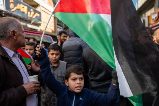 Protesters gather in central Ramallah, a primarily Palestinian city, following Friday prayers to denounce Israel and the war in Gaza on December 08, 2023 in Ramallah. Israel's war against Hamas that was sparked by the Oct. 7 attacks has also made life more volatile in East Jerusalem and the West Bank. Israeli forces here have stepped up raids on alleged militants, police have clashed with protesters, and there has been a rise in violent attacks on Palestinians by Israeli settlers. Last month, Hamas also claimed responsibility for a deadly shooting in Jerusalem by two brothers from the eastern part of the city. <span class="copyright">Spencer Platt-Getty Images</span>