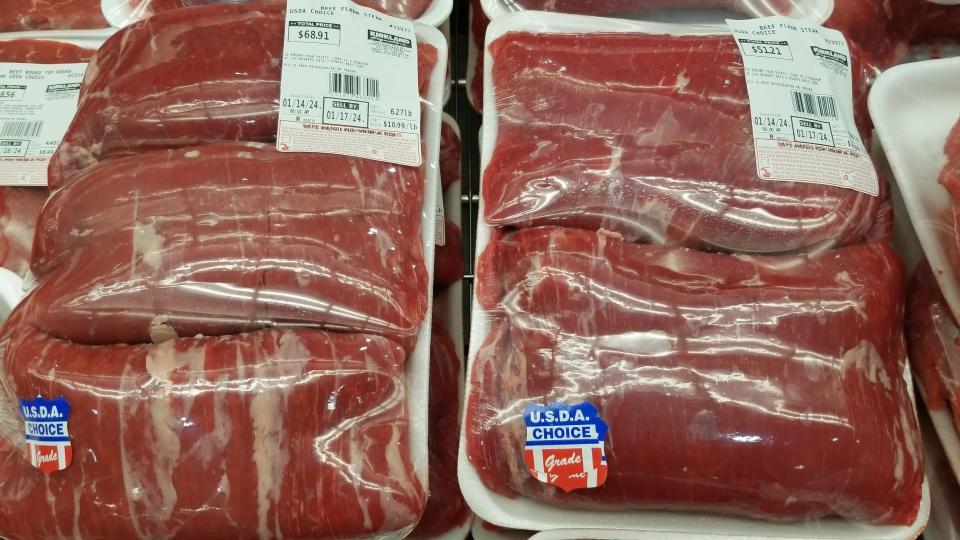 Flank steak apackages on display at Costco 