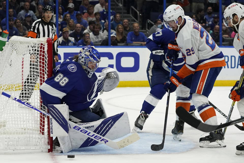 Tampa Bay Lightning goaltender Andrei Vasilevskiy (88) makes a pad save on a shot by New York Islanders center Brock Nelson (29) during the third period in Game 2 of an NHL hockey Stanley Cup semifinal playoff series Tuesday, June 15, 2021, in Tampa, Fla. (AP Photo/Chris O'Meara)