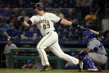 Sep 18, 2018; Pittsburgh, PA, USA; Pittsburgh Pirates pinch hitter Ryan Lavarnway (63) hits a game winning single against the Kansas City Royals during the eleventh inning at PNC Park. The Pirates won 2-1 in eleven innings. Mandatory Credit: Charles LeClaire-USA TODAY Sports