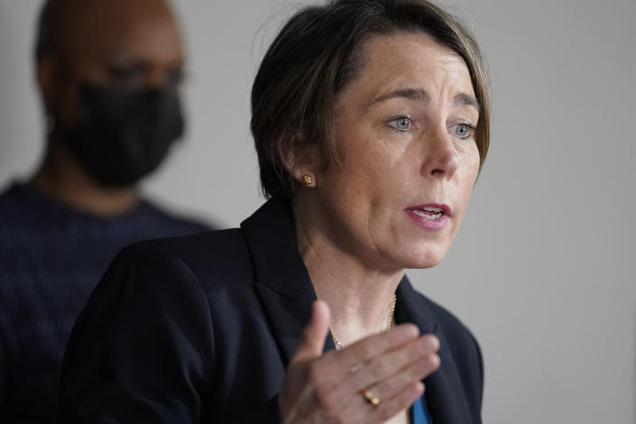 FILE - In this April 1, 2021 file photo, Mass. Attorney General Maura Healey, right, responds to questions from reporters during a news conference in Boston. A congressional committee heard grievances Tuesday, June 8, 2021 against the owners of OxyContin maker Purdue Pharma amid a longshot effort to advance legislation that would keep them from using the corporate bankruptcy process as a shield for personal liability. Healey said she would like to see the bill adopted before an Aug. 9 hearing on Purdue's restructuring plan. (AP Photo/Steven Senne, file)