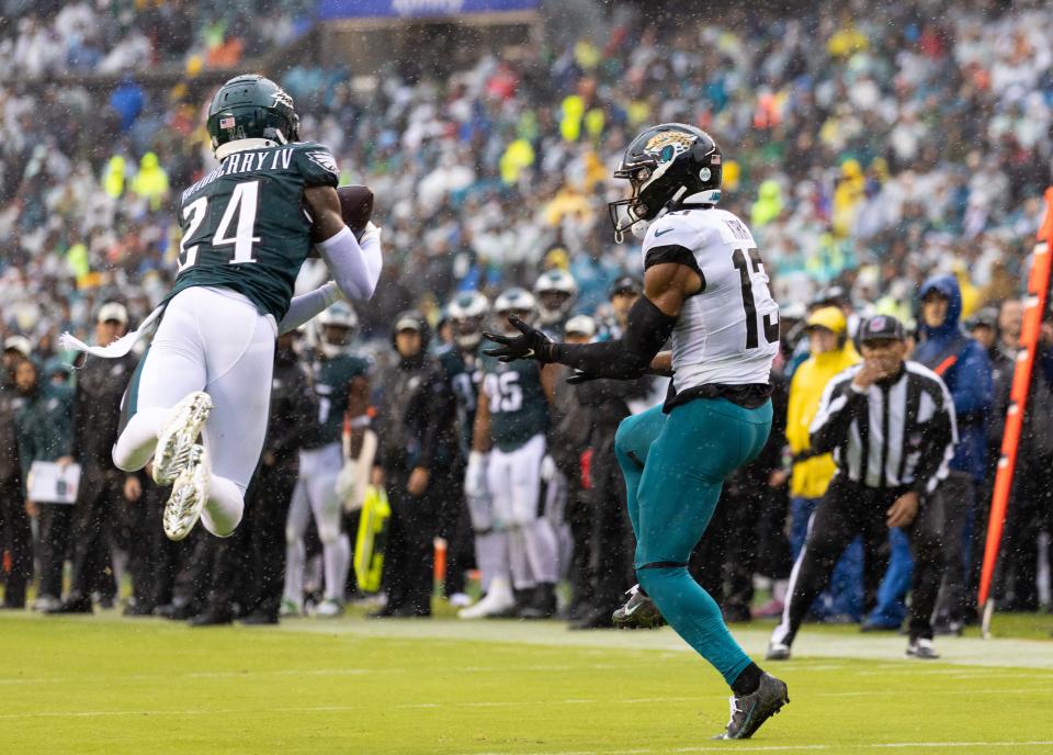 Oct 2, 2022; Philadelphia, Pennsylvania, USA; Philadelphia Eagles cornerback James Bradberry (24) intercepts the ball in front of Jacksonville Jaguars wide receiver Christian Kirk (13) during the third quarter at Lincoln Financial Field. Mandatory Credit: Bill Streicher-USA TODAY Sports