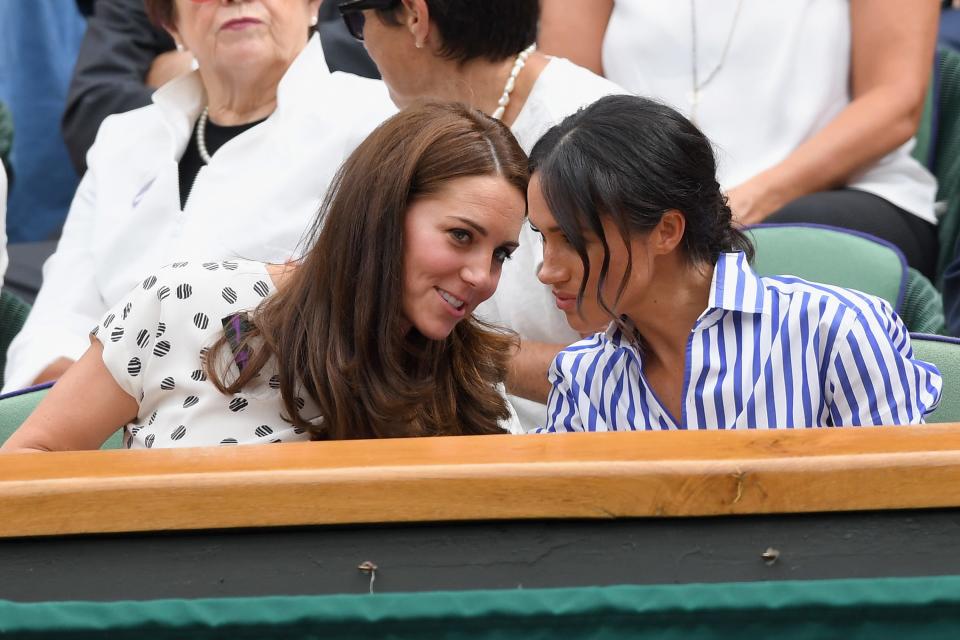 Catherine, Duchess of Cambridge and Meghan, Duchess of Sussex attends day twelve of the Wimbledon Tennis Championships at the All England Lawn Tennis and Croquet Club on July 13, 2018 in London, England.