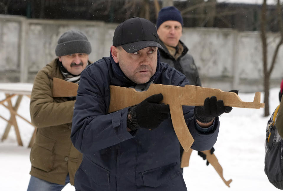 Members of Ukraine's Territorial Defense Forces, volunteer military units of the Armed Forces, train close to Kyiv, Ukraine, Saturday, Feb. 5, 2022. Hundreds of civilians have been joining Ukraine's army reserves in recent weeks amid fears about Russian invasion. (AP Photo/Efrem Lukatsky)