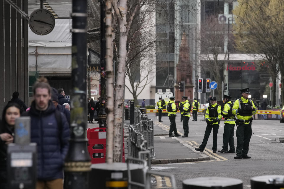Police stand guard outside the hotel where President Joe Biden will stay in Belfast, Northern Ireland, Tuesday, April 11, 2023. President Biden is visiting Northern Ireland and Ireland to celebrate the 25th Anniversary of the Good Friday Agreement. (AP Photo/Christophe Ena)