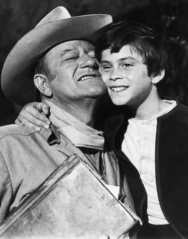 <p>Bettmann</p> John Wayne and John Ethan Wayne on set of 'The Million Dollar Kidnapping'.