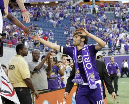 Kaka high-fives fans after the 1-1 draw. (Getty Images)