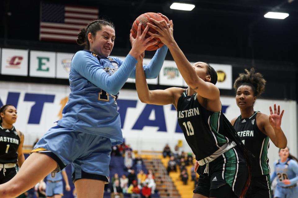 Kent State guard Katie Shumate and Eastern Michigan guard ZaNiya Nelson battle for a rebound under the basket during an NCAA basketball game on Wednesday, January 18, 2023 at the Kent State M.A.C. Center.