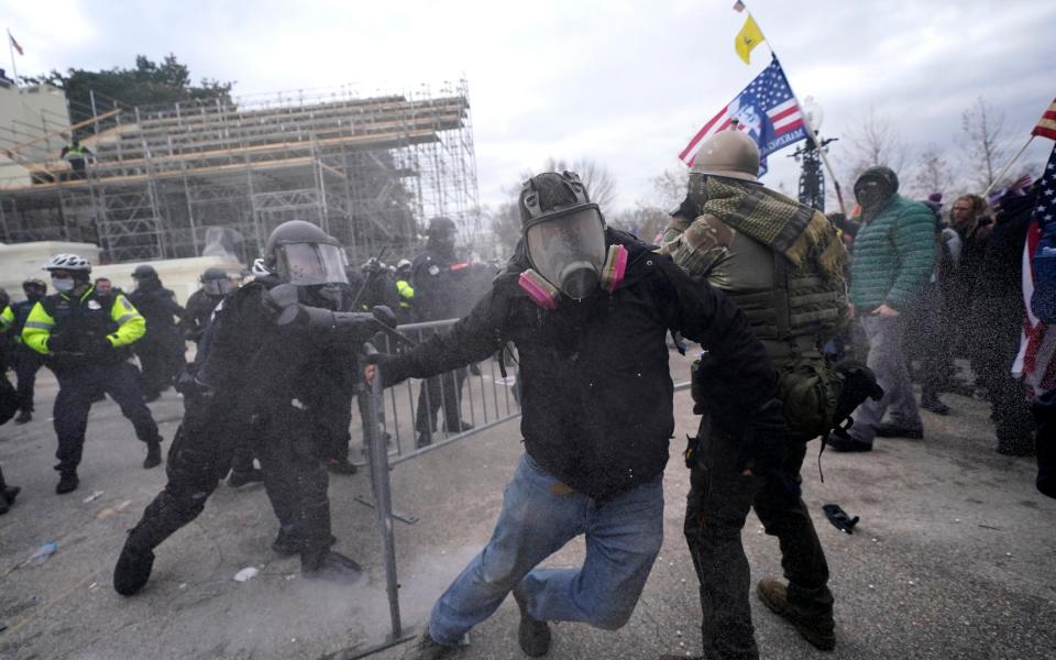 Democrats have warned Donald Trump’s call for protests could trigger a repeat of the chaos his supporters unleashed at the US Capitol in Jan 2021 - AP Photo/John Minchillo