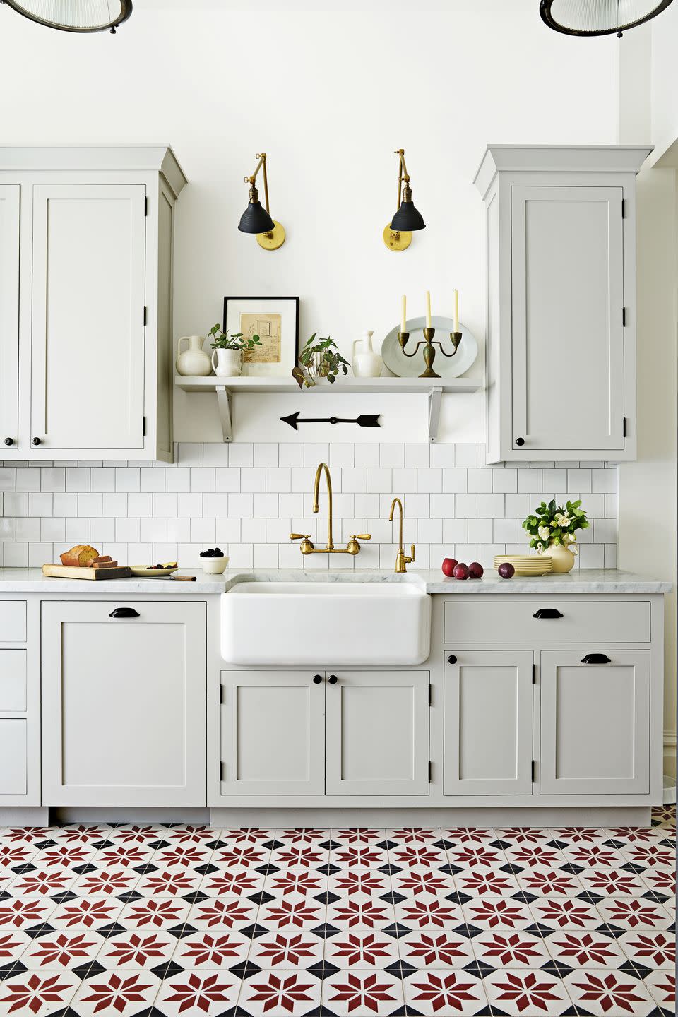 kitchen with gray cabinetry and red patterned tile floor
