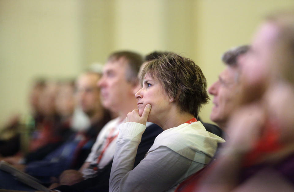 People look on as David Silverman, president of the American Atheists, addresses the American Atheists National Convention in Salt Lake City on Friday, April 18, 2014. In an effort to raise awareness and attract new members, the organization is holding their national conference over Easter weekend in the home of The Church of Jesus Christ of Latter-day Saints. (AP Photo/Rick Bowmer)