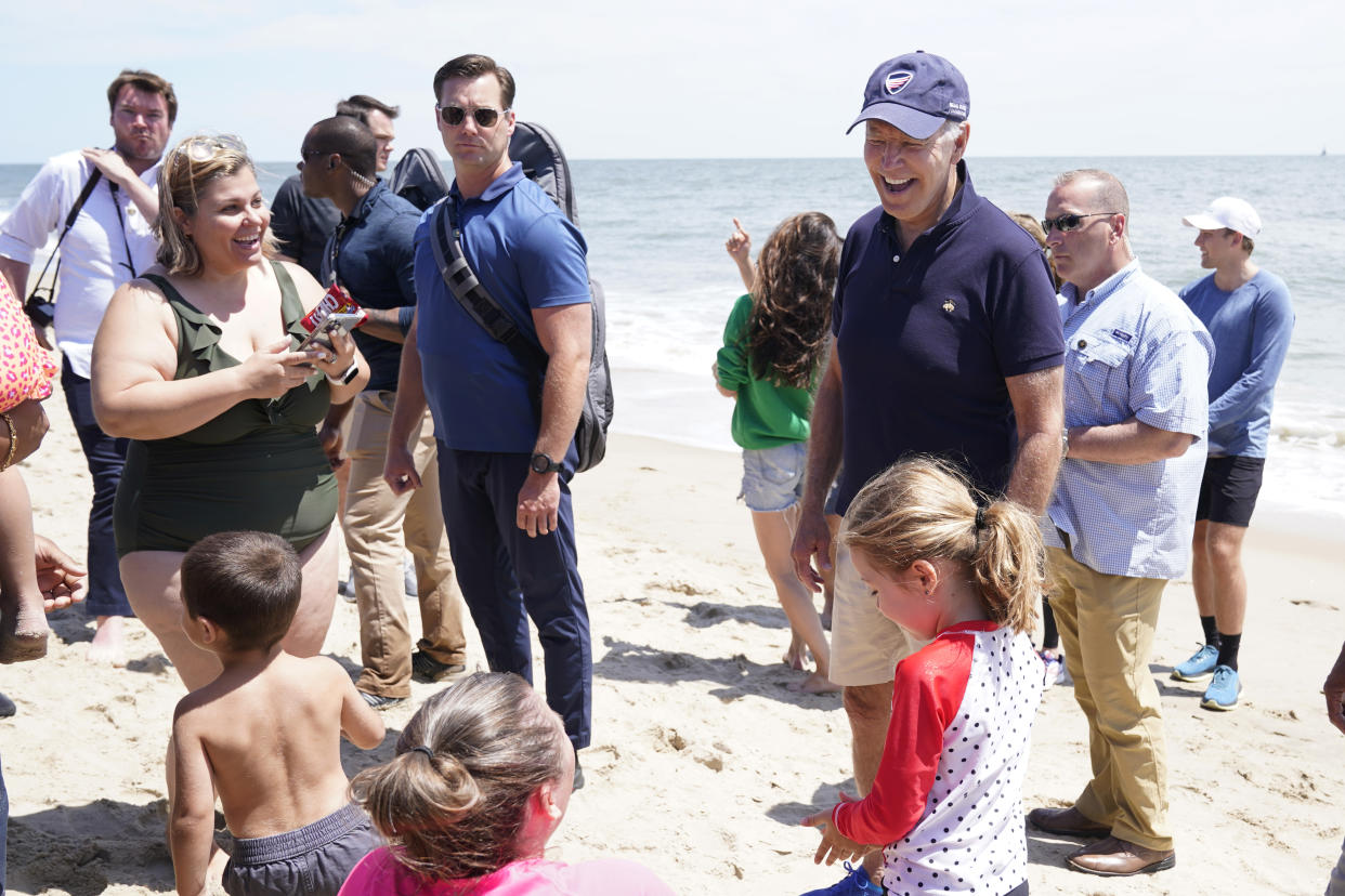 President Joe Biden talks to people after walking on the beach with his granddaughter Natalie Biden and his daughter Ashley Biden, Monday, June 20, 2022 at Rehoboth Beach, Del. (AP Photo/Manuel Balce Ceneta)