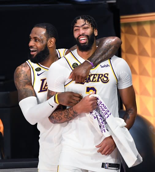 LeBron James, left, and Anthony Davis celebrate in the closing seconds of Game 6 of the NBA Finals