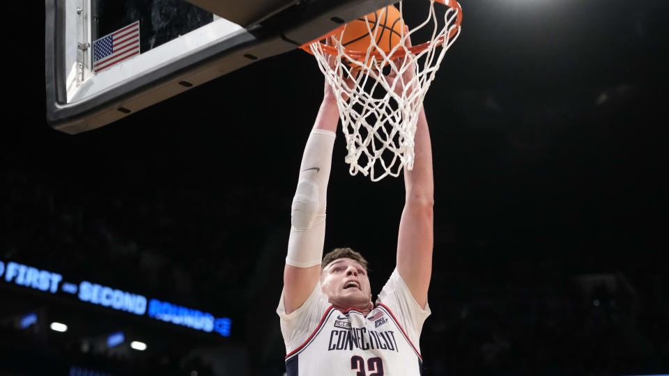 UConn center Donovan Klingan dunks during the first half of a college basketball second-round game against Northwestern in the NCAA Tournament, Sunday, March 24, 2024, in New York.  (AP Photo/Mary Altaffer)