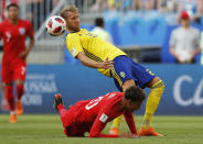 <p>Sweden’s Ola Toivonen, above, vies for the ball with England’s Dele Alli </p>