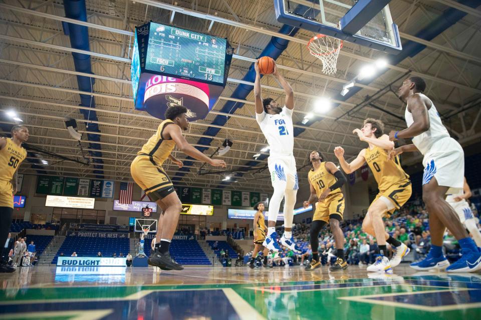 Florida Gulf Coast Eagles center Kevin Samuel (21) grabs a rebound during the first half of the Hilton Garden Inn FGCU Invitational between the Purdue Fort Wayne Mastodons and the Florida Gulf Coast Eagles, Sunday, Nov. 28, 2021, at Alico Arena in Fort Myers, Fla.FGCU led Purdue Fort Wayne 34-32 at halftime.