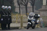 Chinese security personnel stand guard near the Great Hall of the People in Beijing Wednesday, March 3, 2021. In a sign of confidence China has reverted back to holding its annual Congress meetings to march this year after delaying them due to the outbreak of the coronavirus last year. As usual, security has been tightened in the capital with paramilitary troops patrolling near the Great Hall of the People where the meetings are held and standing guard at subway stations. (AP Photo/Ng Han Guan)