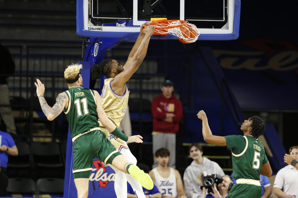 Tulsa forward Jared Garcia (15) dunks over South Florida during the first half of an NCAA college basketball game, Saturday, March 9, 2024, in Tulsa, Okla. (AP Photo/Joey Johnson)