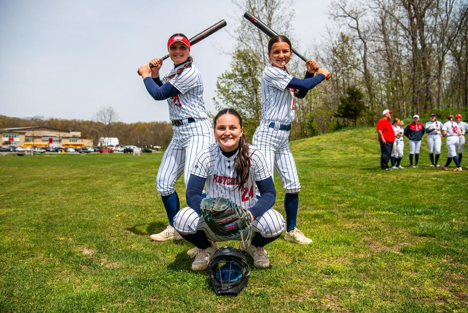 Ketcham's Hotle sisters Kat, left, Paige, center, and Grace, right, stand for a portrait during the Bisaccia Softball Tournament on April 27, 2024.