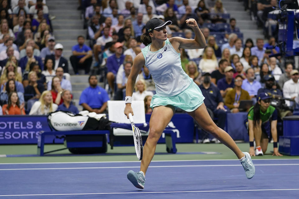 Iga Swiatek, of Poland, reacts after scoring a point against Aryna Sabalenka, of Belarus, during the semifinals of the U.S. Open tennis championships, Thursday, Sept. 8, 2022, in New York. (AP Photo/Charles Krupa)