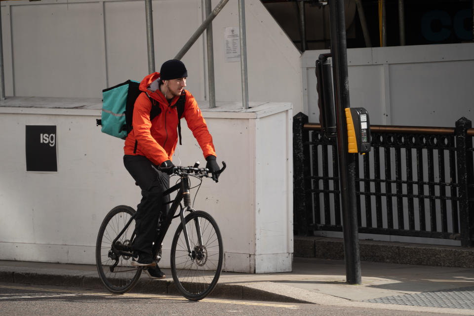 A food delivery rider working for Deliveroo in London, an example of the so-called gig economy. Photo date: Wednesday, March 18, 2020. Photo credit should read: Richard Gray/EMPICS