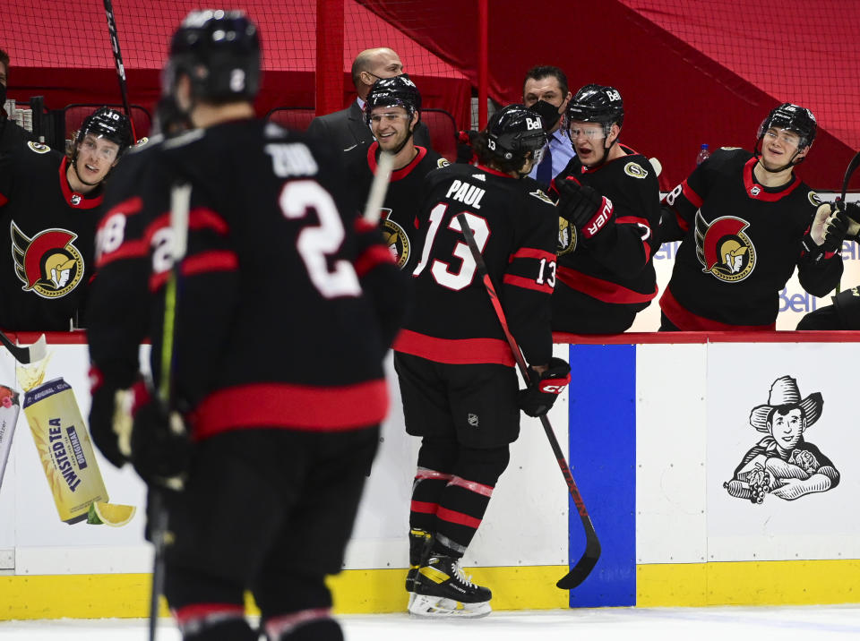 Ottawa Senators' Nick Paul celebrates a goal with the bench against the Montreal Canadiens during the third period of an NHL hockey game, Wednesday, May 5, 2021 in Ottawa, Ontario. (Sean Kilpatrick/The Canadian Press via AP)