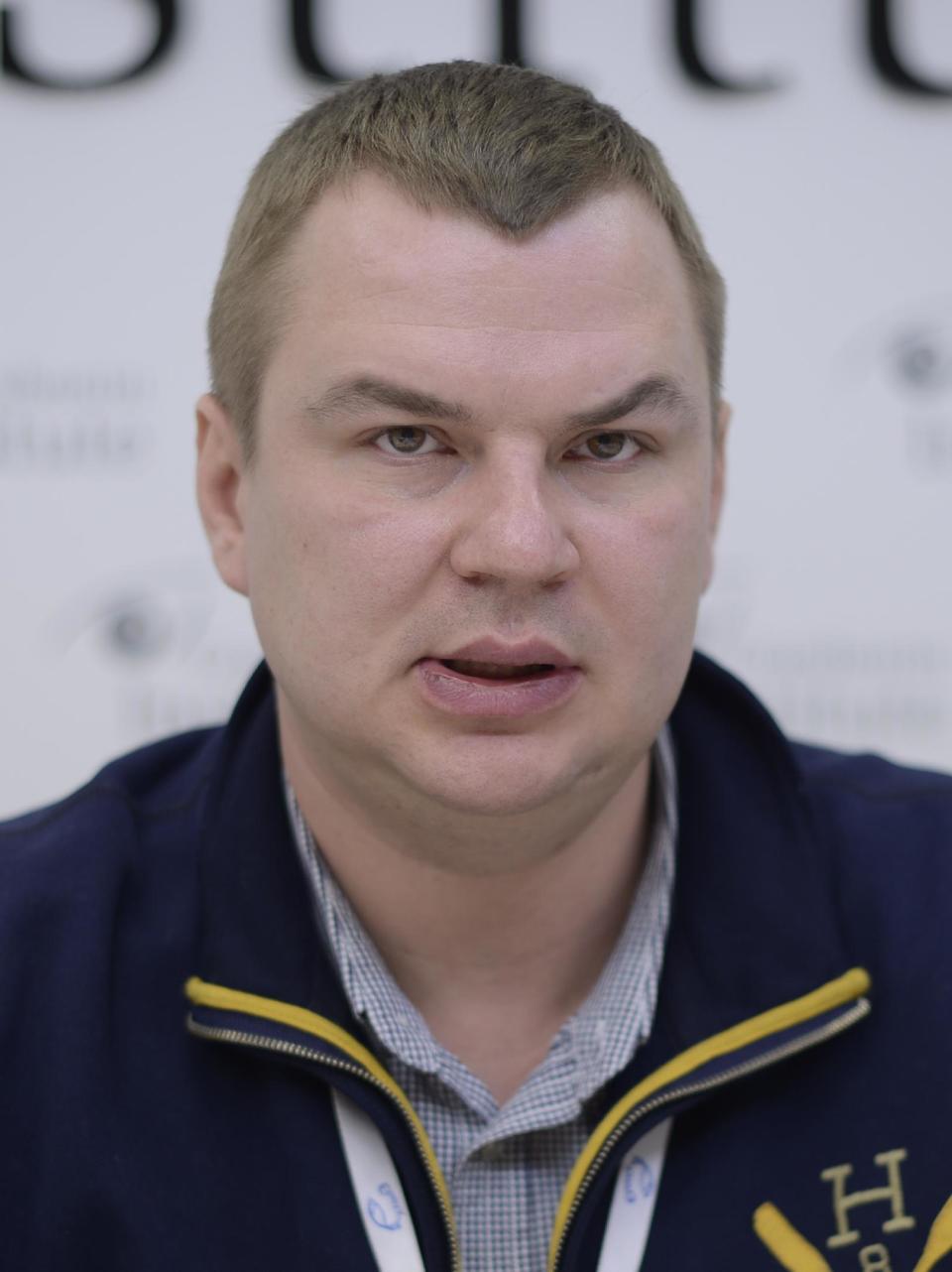 In this photo taken on Jan. 13, 2014, Dmytro Bulatov speaks to press during an interview in Kiev, Ukraine. Bulatov a Ukrainian opposition activist who went missing last week says he was kidnapped and tortured, the latest in a string of mysterious attacks on anti-government protesters in the two-month-long political crisis. Dmytro Bulatov, 35, a member of Automaidan, a group of car owners that has taken part in the protests against President Viktor Yanukovych, went missing Jan. 22. He was discovered outside Kiev on Thursday, Jan. 30, 2014. He said his kidnappers beat him severely, nailed him to a cross, sliced off a piece of ear and cut his face. (AP Photo/Maks Levin)