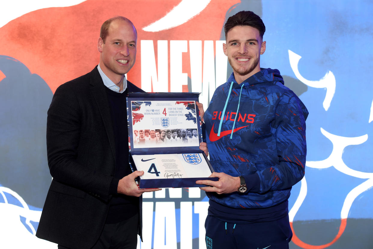 BURTON UPON TRENT, ENGLAND - NOVEMBER 14: Prince William, Prince of Wales presents an England shirt to Declan Rice of England at St George's Park on November 14, 2022 in Burton upon Trent, England. (Photo by Eddie Keogh - The FA/The FA via Getty Images)