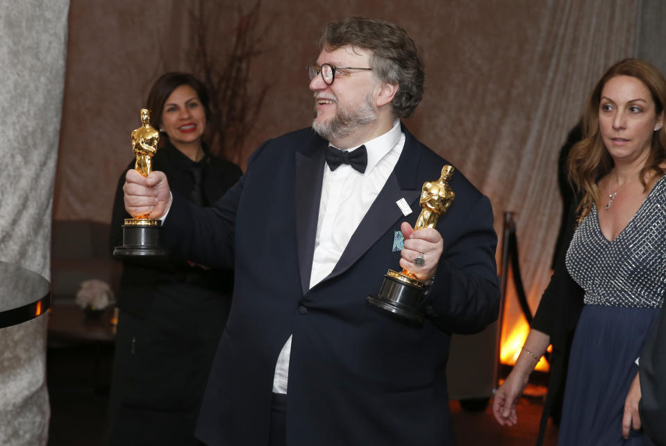 Guillermo del Toro poses with his awards for best director and best picture for “The Shape of Water” at the Governors Ball after the Oscars on Sunday, March 4, 2018, at the Dolby Theatre in Los Angeles. (Photo by Eric Jamison/Invision/AP)