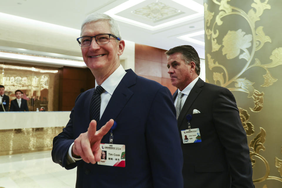 Apple CEO Tim Cook reacts at the annual meeting of the China Development Forum at the Diaoyutai Guesthouse in Beijing, China, Sunday, March 24, 2024. The China Development Forum runs until Monday, with the theme 
