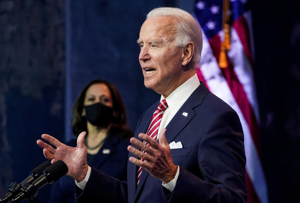 President-elect Joe Biden speaks as Vice President-elect Kamala Harris stands by in Wilmington, Del., on Nov. 16, 2020. (REUTERS/Kevin Lamarque/File Photo)