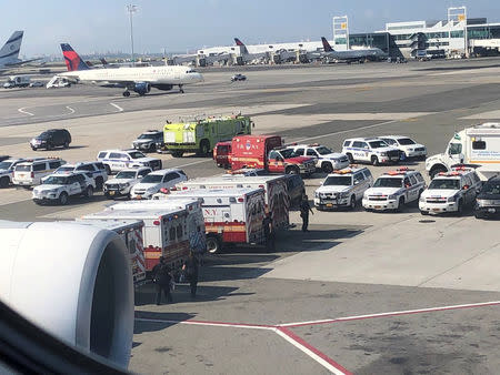 FILE PHOTO: The emergency services are seen, after the passengers were taken ill on a flight from New York to Dubai, on JFK Airport, New York, U.S., September 05, 2018 in this still image obtained from social media. Larry Coben/via REUTERS