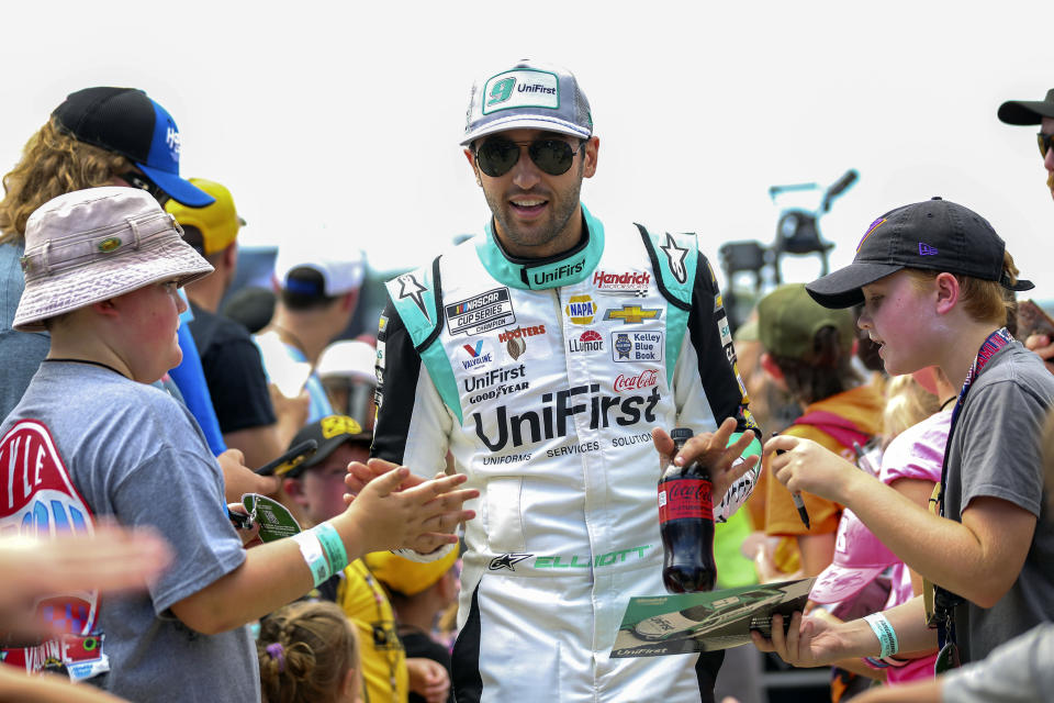 FILE - Chase Elliott is greeted by fans during driver introductions for the NASCAR Cup Series auto race July 30, 2023, in Richmond, Va. Elliott overcame the worst season of his career to maintain his hold on the NASCAR most popular driver award for the sixth consecutive year. Elliott missed seven races this season, failed to make the playoffs and wasn't required to attend the season-ending awards ceremony. But he showed to pick up the only award solely voted on by fans. (AP Photo/Skip Rowland, File)