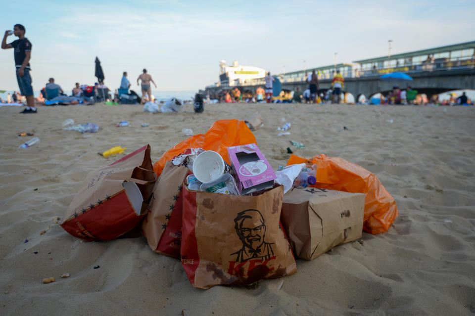 KFC and supermarket packaging is left in a pile on Bournemouth Beach on Thursday afternoon. (Getty)