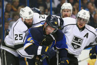 ST. LOUIS, MO - APRIL 30: Dustin Penner #25 and Anze Kopitar #11 both of the Los Angeles Kings mix it up with David Backes #42 of the St. Louis Blues in Game Two of the Western Conference Semifinals during the 2012 NHL Stanley Cup Playoffs at the Scottrade Center on April 30, 2012 in St. Louis, Missouri. (Photo by Dilip Vishwanat/Getty Images)