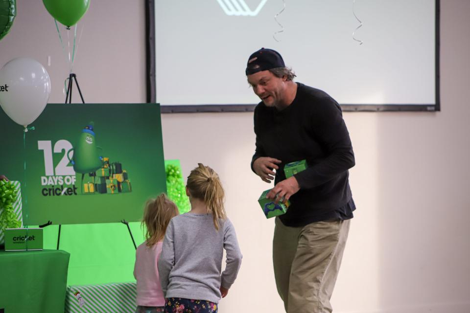 Daniel Baker and his two daughters are recipients of Cricket Wireless' 12 Days of Cricket, in conjunction with the Boys and Girls Clubs of America. His and two other families in Sioux Falls were given $5,000 in gifts on Tuesday, Nov. 29.