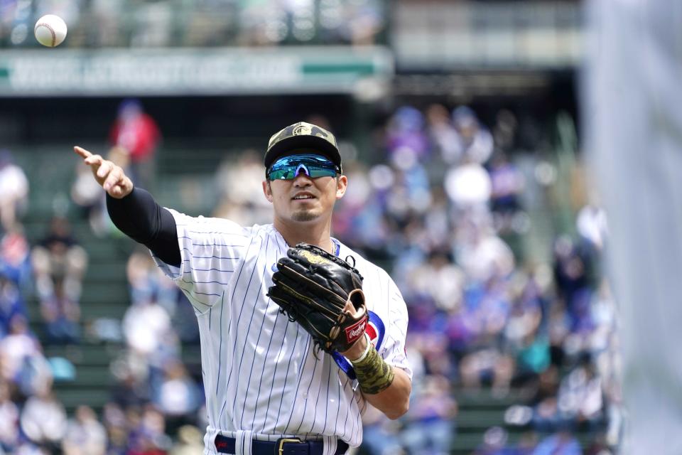 Chicago Cubs' Seiya Suzuki, of Japan, warms up before a baseball game against the Arizona Diamondbacks in Chicago, Sunday, May 22, 2022. (AP Photo/Nam Y. Huh)