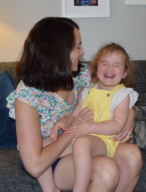 Jill Smith with her 3-year-old daughter, Lettie, in the living room of their home in Madison.