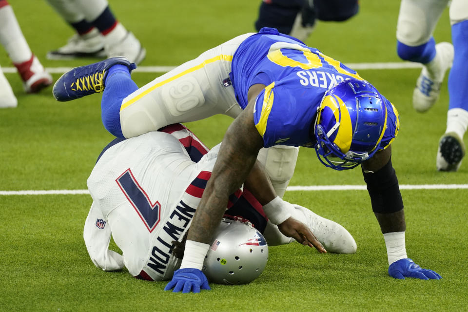 New England Patriots quarterback Cam Newton (1) is sacked by Los Angeles Rams defensive end Michael Brockers. (AP Photo/Ashley Landis)