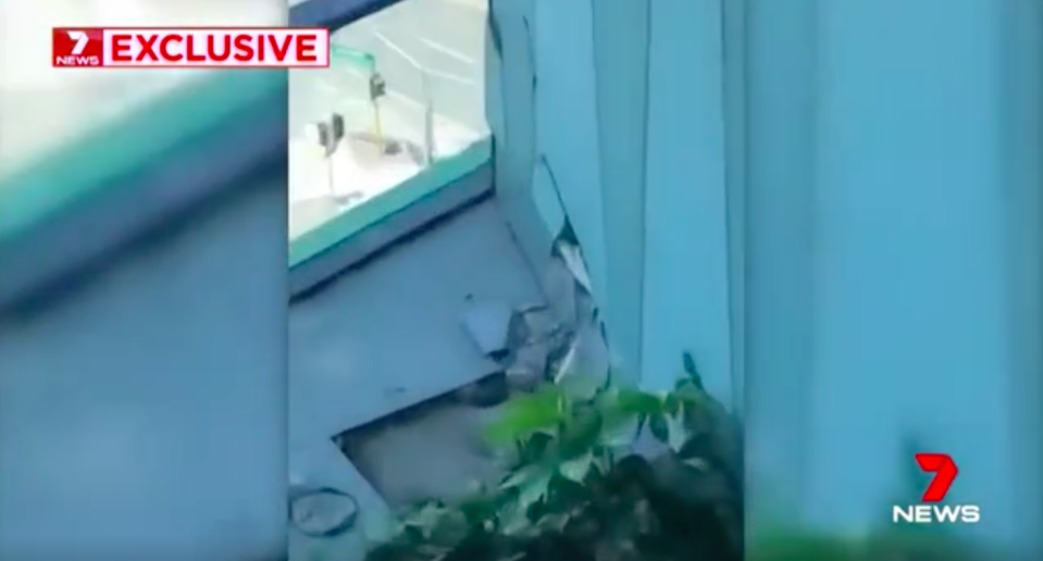 The resident filmed a cracked section of his apartment’s balcony. Source: 7News