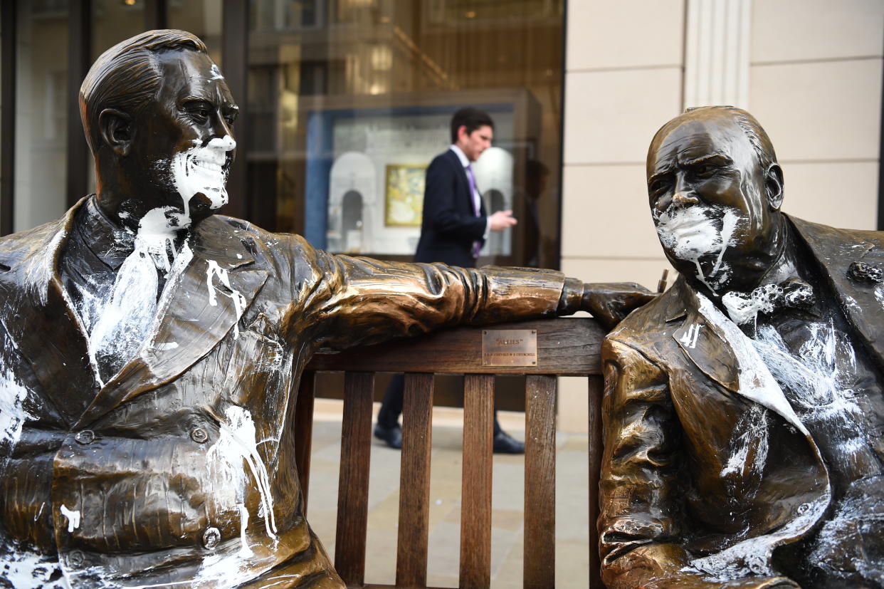 The figures of Franklin D Roosevelt and Winston Churchill on the Allies sculpture in New Bond Street, London, which has been vandalised with white paint.