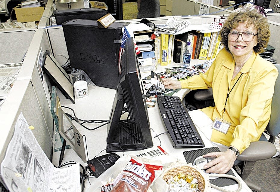 Times Herald-Record columnist Barbara Bedell sits at her desk in the newsroom in Middletown.