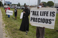 Protesters against the death penalty gather in Terre Haute, Ind., Wednesday, July 15, 2020. Wesley Ira Purkey, convicted of a gruesome 1998 kidnapping and killing, is scheduled to be executed Wednesday evening at the federal prison in Terre Haute. (AP Photo/Michael Conroy)