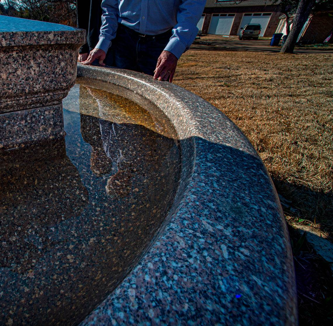 David Hunn replumbed the granite bowl that now sits on their front yard.