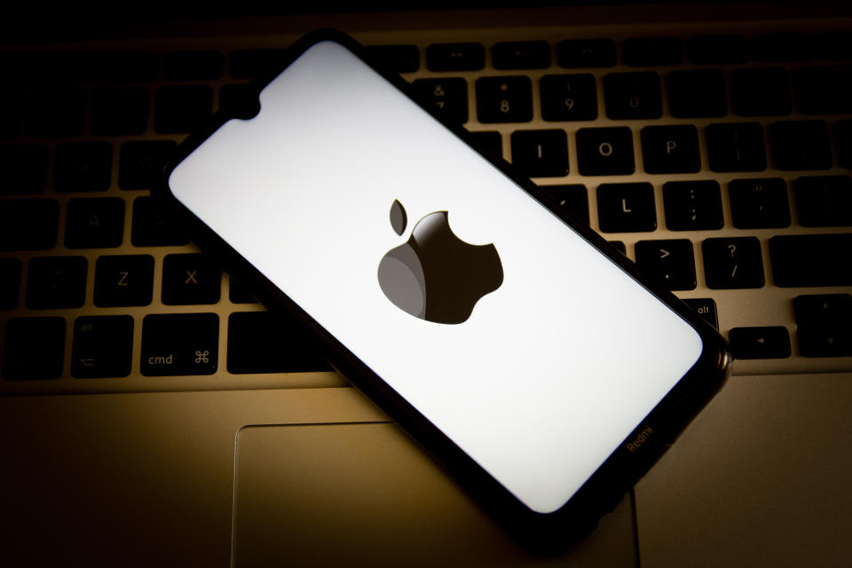 GREECE - 2021/04/26: In this photo illustration, an Apple logo seen displayed on a smartphone screen with a computer keyboard in the background. (Photo Illustration by Nikolas Joao Kokovlis/SOPA Images/LightRocket via Getty Images)