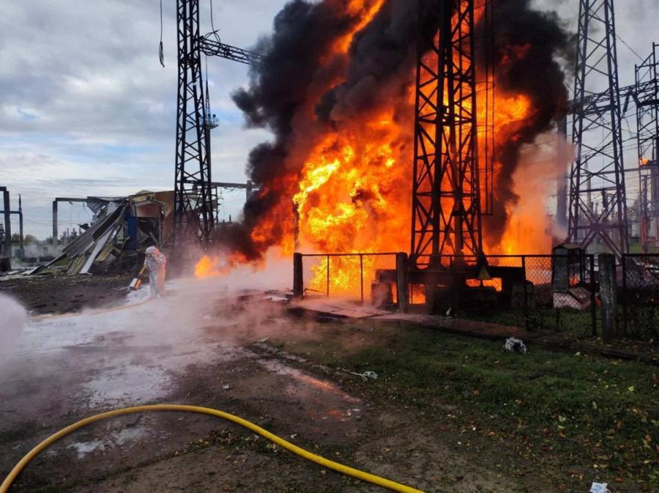 Firefighters try to put out a blaze at energy facilities hit by Russian strikes (via REUTERS)