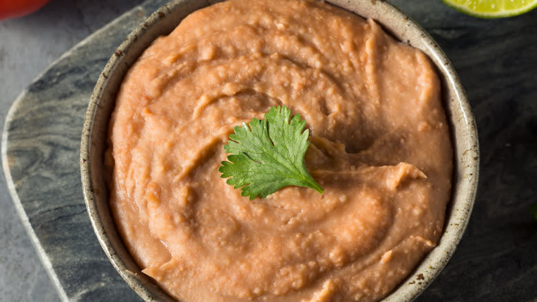 Refried beans garnished with cilantro