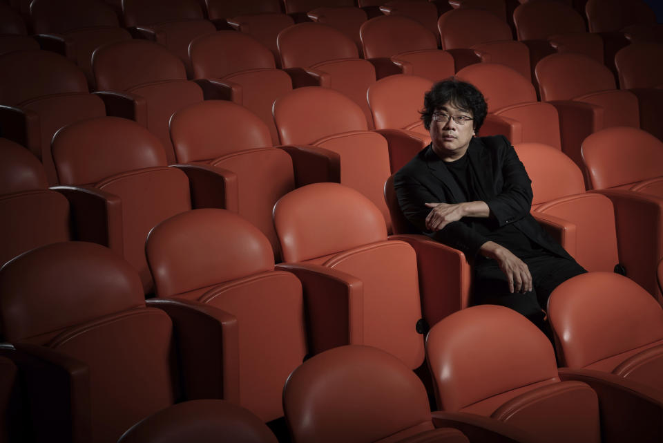 This Oct. 8, 2019 photo shows filmmaker Bong Joon-Ho posing for a portrait at the Whitby Hotel screening room in New York to promote his film "Parasite." The film will open in theaters Friday having already amassed $70.9 million in Bong's native South Korea. In May, "Parasite" won the Palme d’Or at the Cannes Film Festival, a first for a Korean film. (Photo by Christopher Smith/Invision/AP)