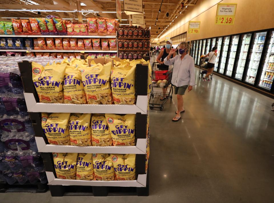 Shoppers browse the aisles on the opening day of the Wegmans in Harrison, Westchester County, on Aug. 5, 2020.