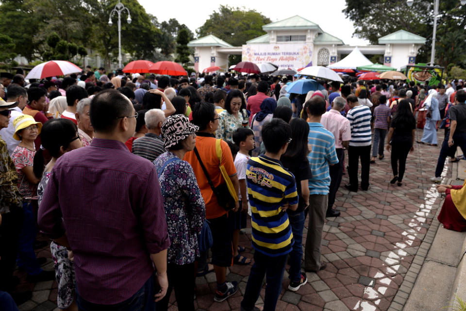 People queue for the Prime Minister’s Raya Open House at Seri Perdana in Putrajaya June 5, 2019. — Picture by Miera Zulyana